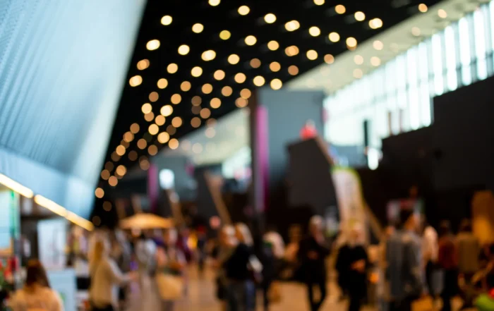 Blurred crowd of people in modern interior during event